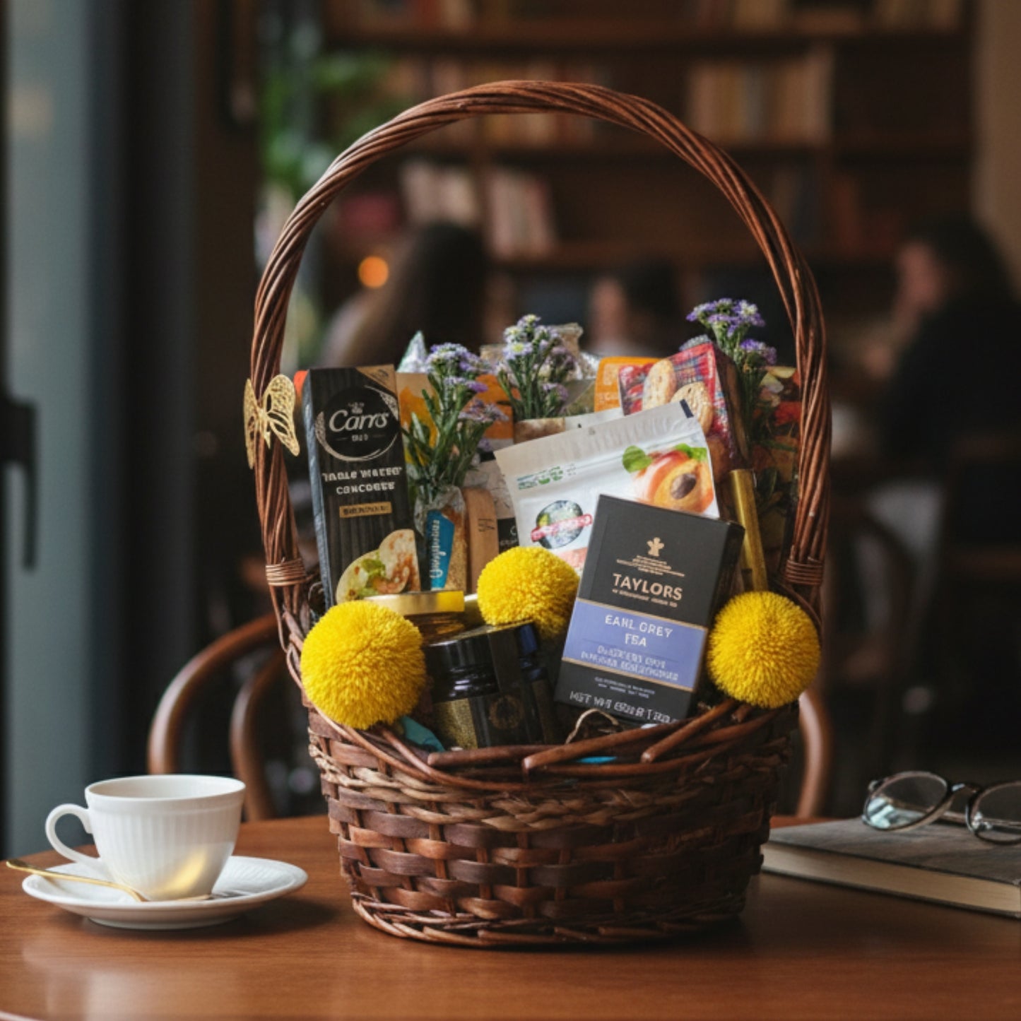 Gourmet Welcome Basket – Tea, Treats & Floral Touch